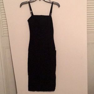 Mid calf length,black with adjustable straps dress, has side pockets & stercb